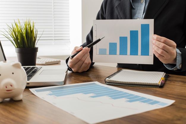 front-view-businessman-holding-growth-chart_23-2148780635